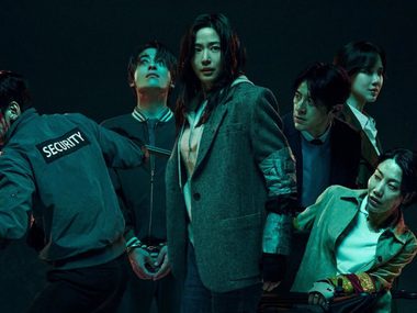 A group of Korean survivors on high alert looking nervous with weapons.