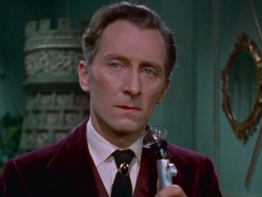 Peter Cushing as Van Helsing wearing a crimson suit. A castle is in the background.