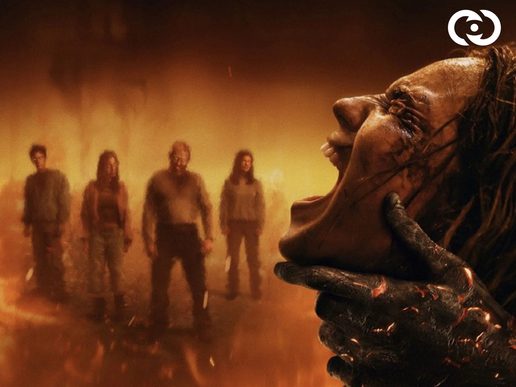 A womans face is on the right, she is being grabbed by a burnt hand and screaming. There are background charcters out of focus in fire.
