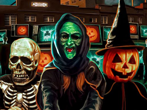 Three Halloween characters are standing in front of TV's - a pumpkin, a ghoul and a skull.