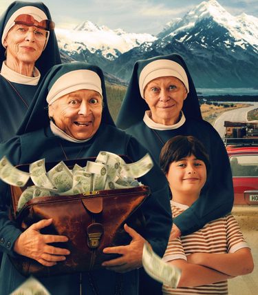 Three nuns are in the foreground with a suitcase of cash, a speeding car on a desert backdrop is behind them.