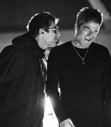 Black and white photo of Noel & Liam Gallagher back stage at Wembley.