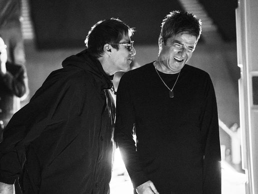 Black and white photo of Noel & Liam Gallagher back stage at Wembley.