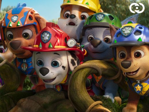 Members of Paw Patrol - dog based emergency services - are crowding around together to look at something.
