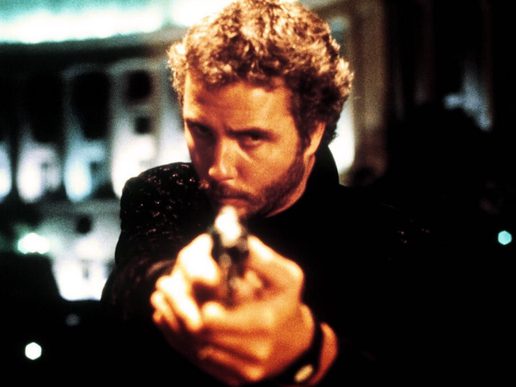 A man in pointing a gun towards the viewer.