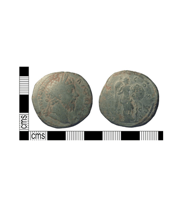A copper-alloy coin known as a ‘sestertius’, depicting Emperor Marcus Aurelius on the obverse and a figure depicting Victory on the reverse. Minted in Rome, this coin was found associated with a Roman farming settlement on the downs north of Worthing.
