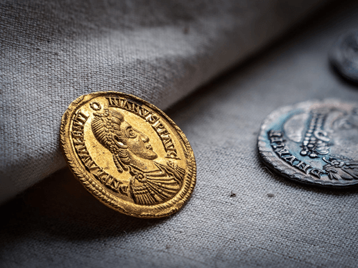 The Patching Hoard was discovered by two metal detectorists, Terry Bromley & Terry Silver, in a field near Patching village in 1997. A total of 23 gold solidi, 27 silver siliquae, 2 gold rings of exceptional purity and a Roman-pound weight of hack silver were recovered from the site. The hoard is one of the last ‘Roman’ coin hoards to be found in Britain, much of it being acquired on the Continent and brought into Sussex at a time when the Western Roman Empire was crumbling and new polities were emerging on either side of the Channel.