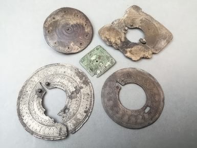 A selection of brooches and a silver plated mount from Highdown Hill
