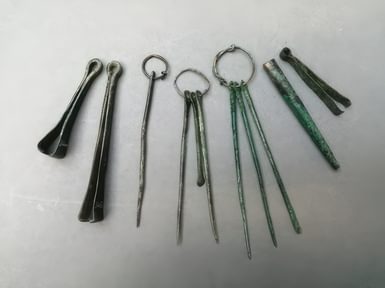 A selection of toilet sets tweezers and a brush ferrule from Highdown Hill