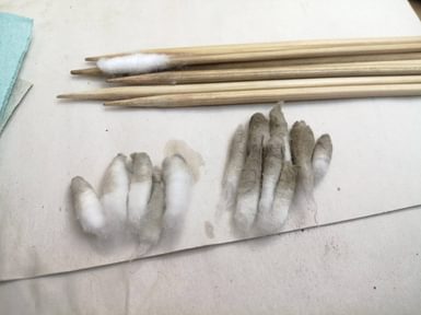 Cotton wool swabs after cleaning Left water right acetone
